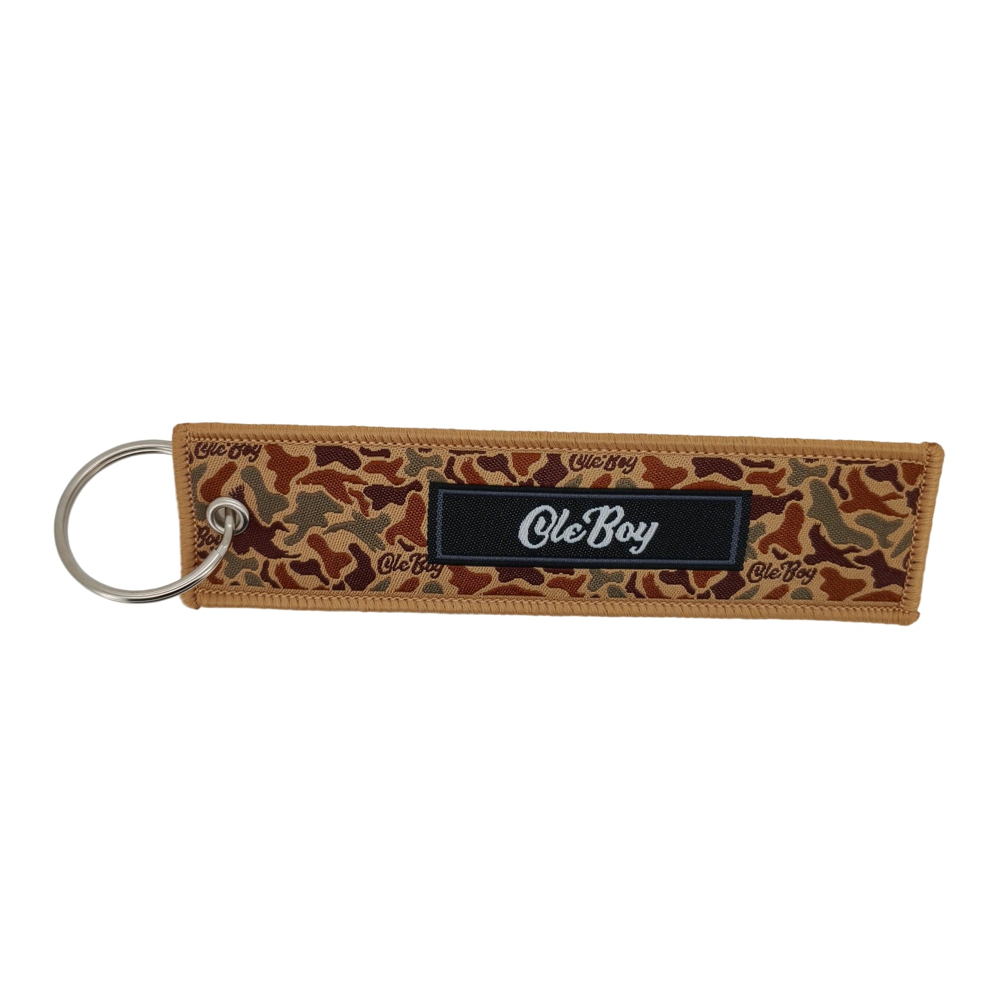 Camouflage-patterned keychain with 'ole Boy' branding on a white background