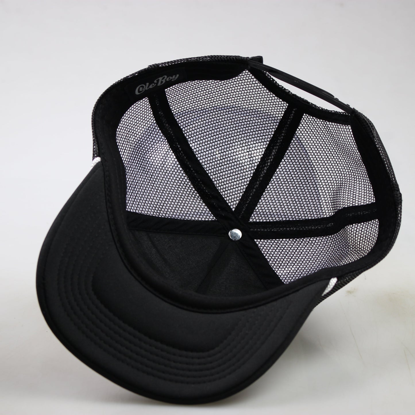Black mesh cap on a white background