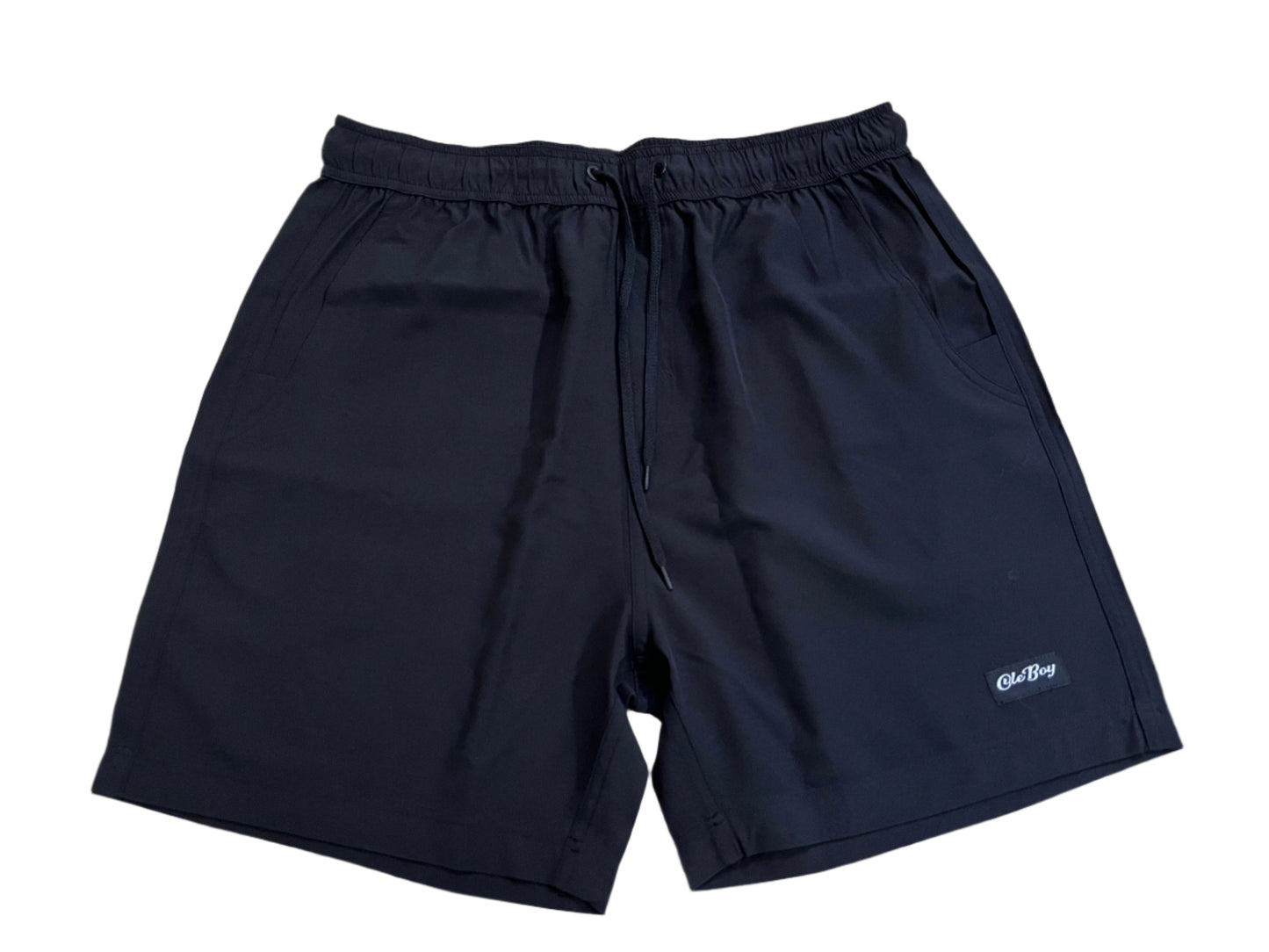 Navy blue shorts with a ole boy brand logo on a white background