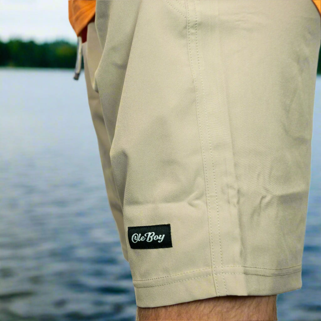 Beige shorts with a visible brand label on a plain background