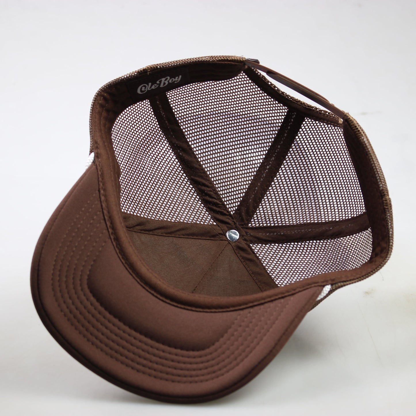 Brown mesh cap on a white background