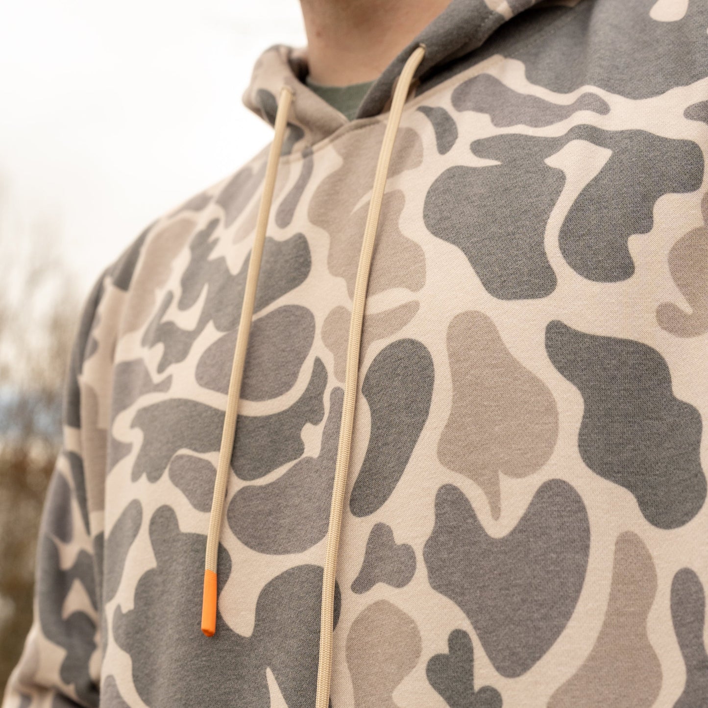 Camouflage hoodie with a neutral color scheme