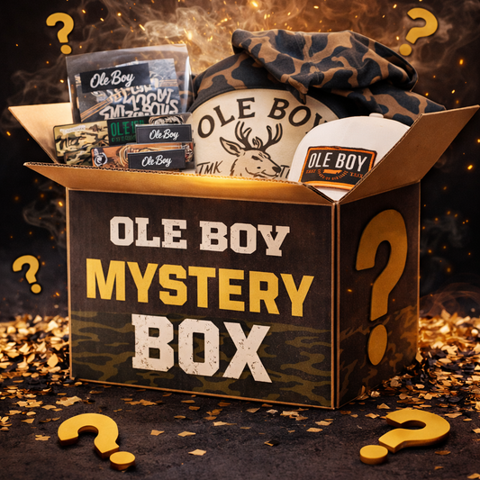 Ole Boy mystery box with various items on a dark background