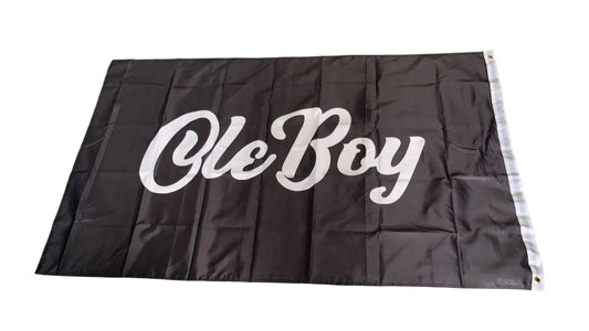 Black flag with 'Ole Boy' text in white on a gray floor.