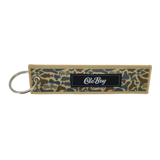 Keychain with camouflage pattern and 'Ole Boy' branding on a white background