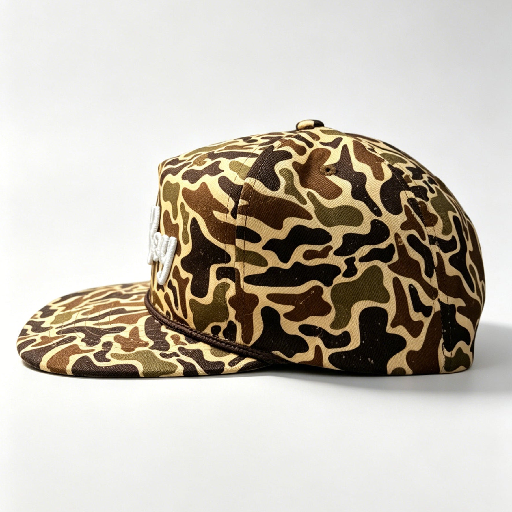 Camouflage-patterned cap on a white background