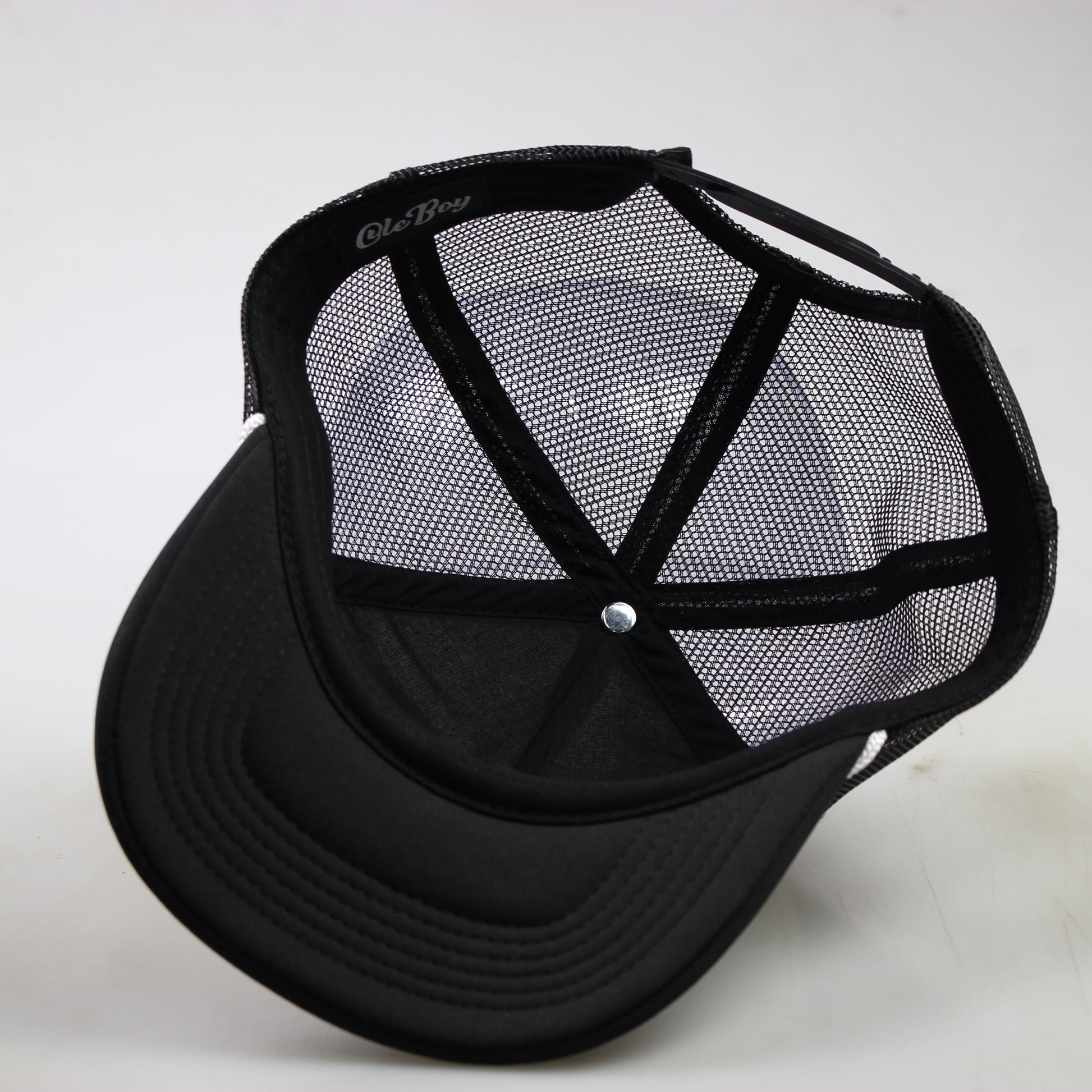 Black mesh cap on a white background