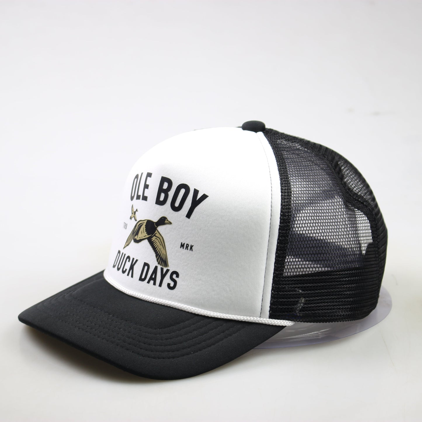 Black and white trucker hat with text and duck graphic on a white background