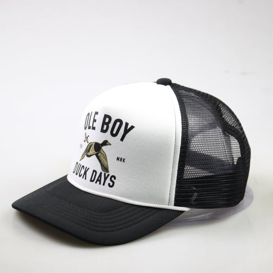 Black and white trucker hat with text and duck graphic on a white background