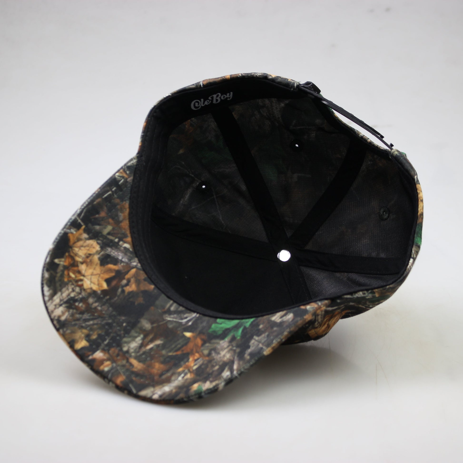 Camouflage-patterned baseball cap on a white background