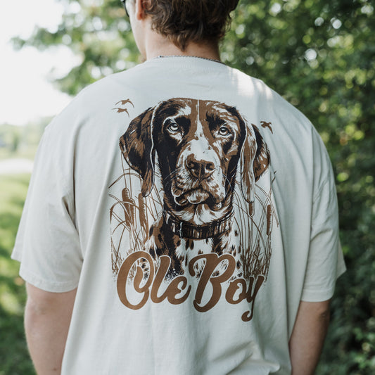 Person wearing a t-shirt with a GSP dog illustration and 'Ole Boy' text outdoors.