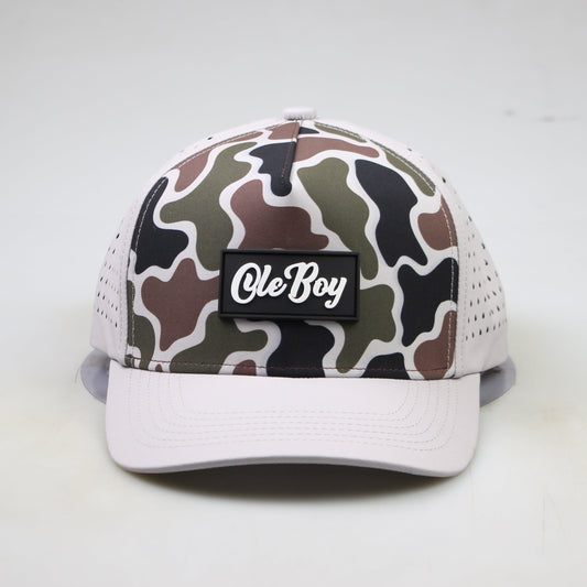 Camouflage-patterned cap with 'Ole Boy' logo on a white background