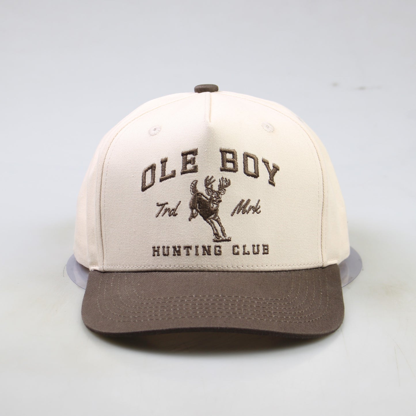 Cap with 'Ole Boy Hunting Club' text and logo on a light gray background