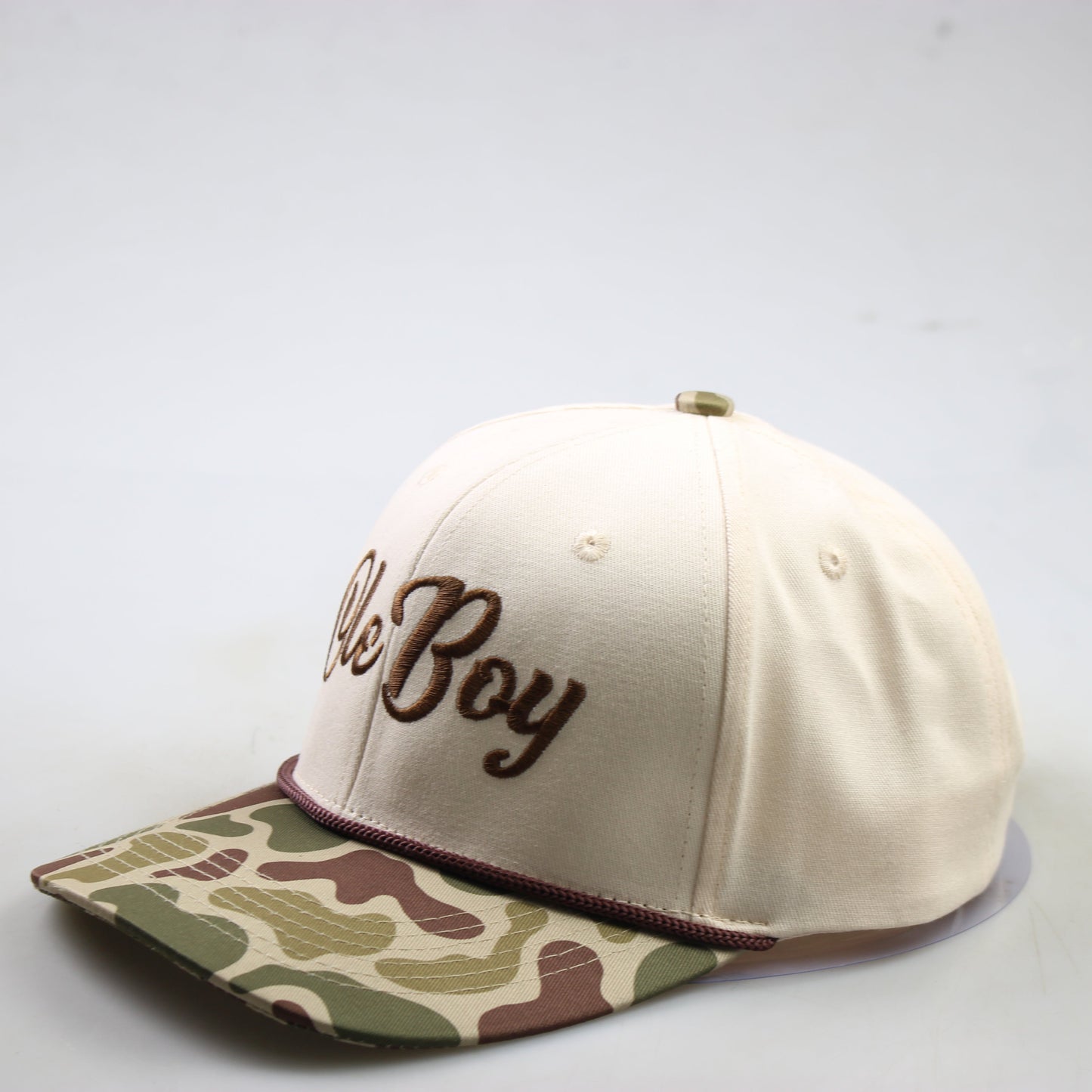 Beige cap with camouflage brim and 'Ole Boy' embroidery on a white background