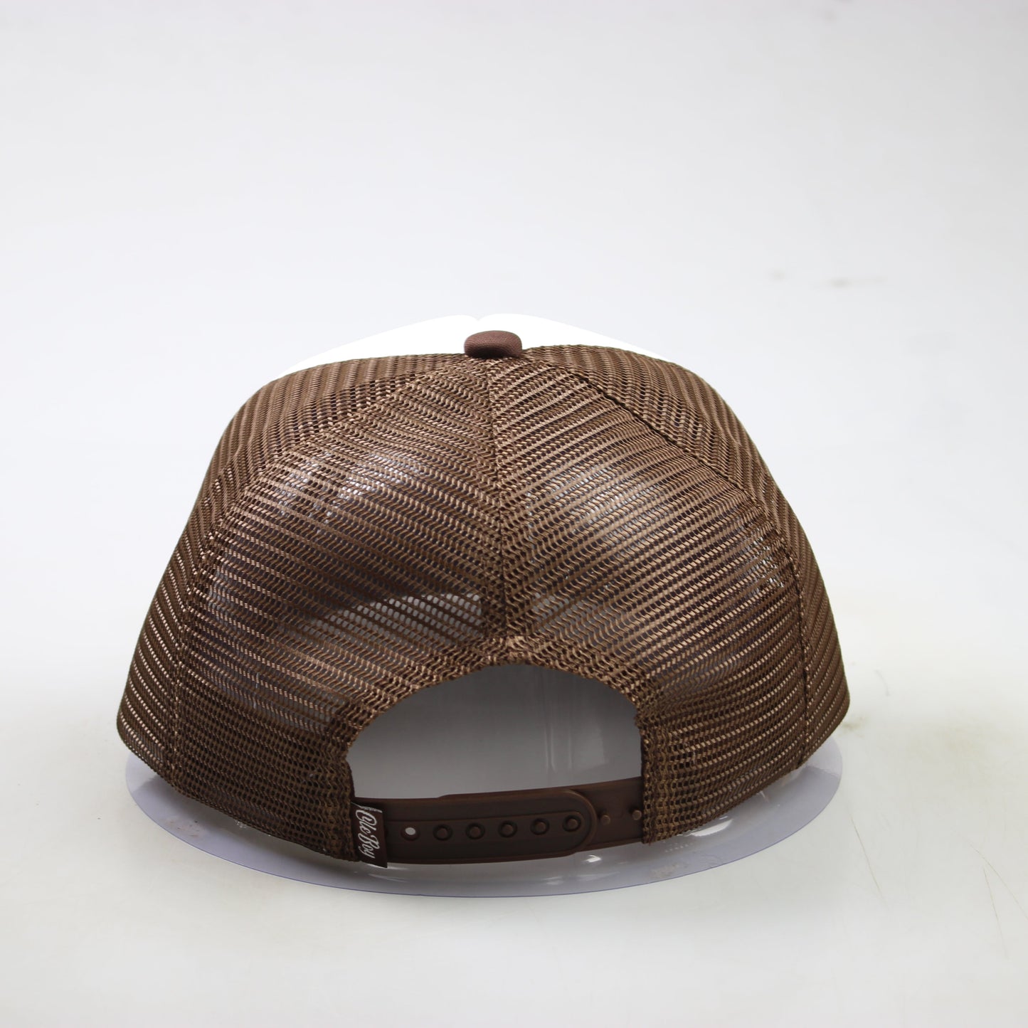 Brown textured baseball cap on a white background