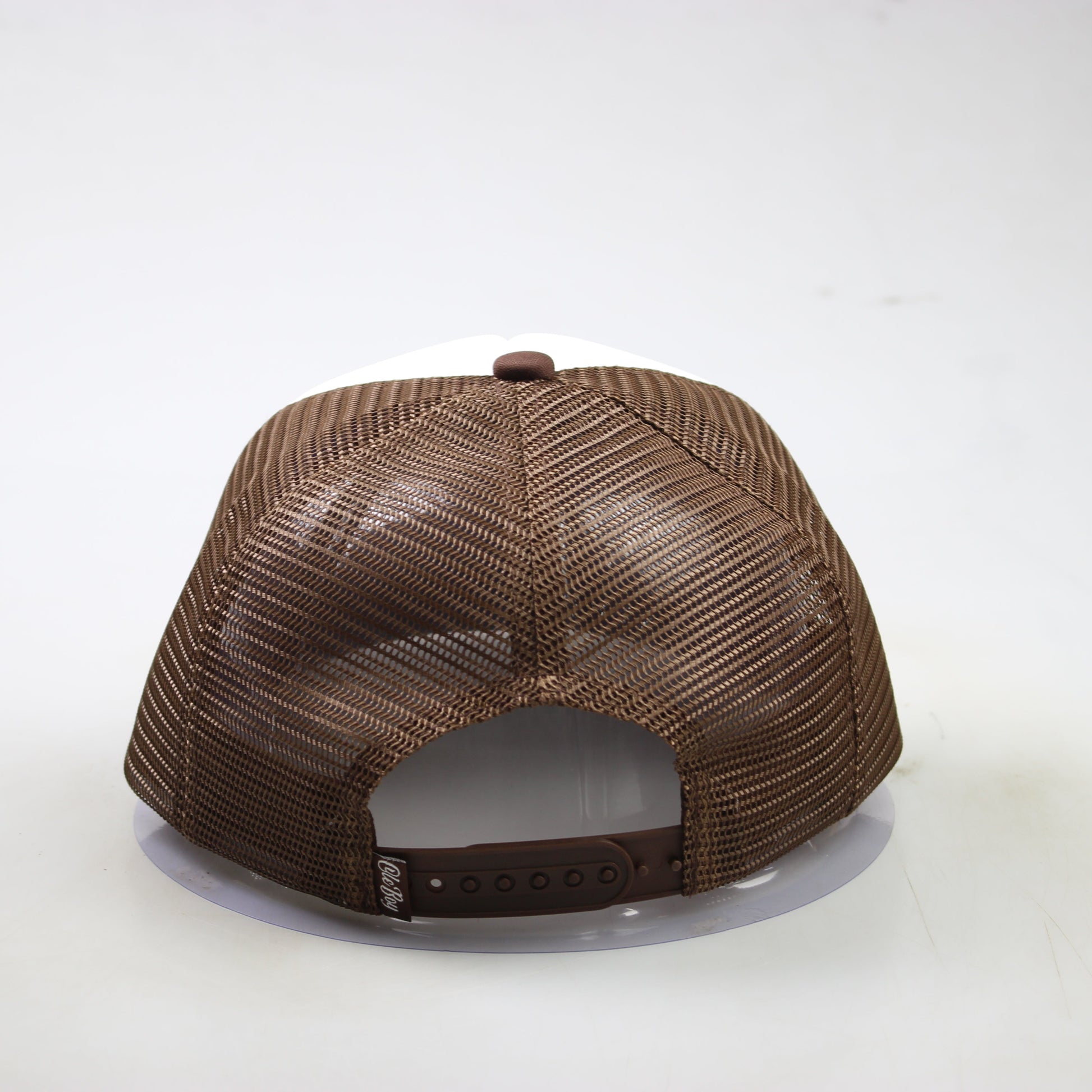 Brown textured baseball cap on a white background