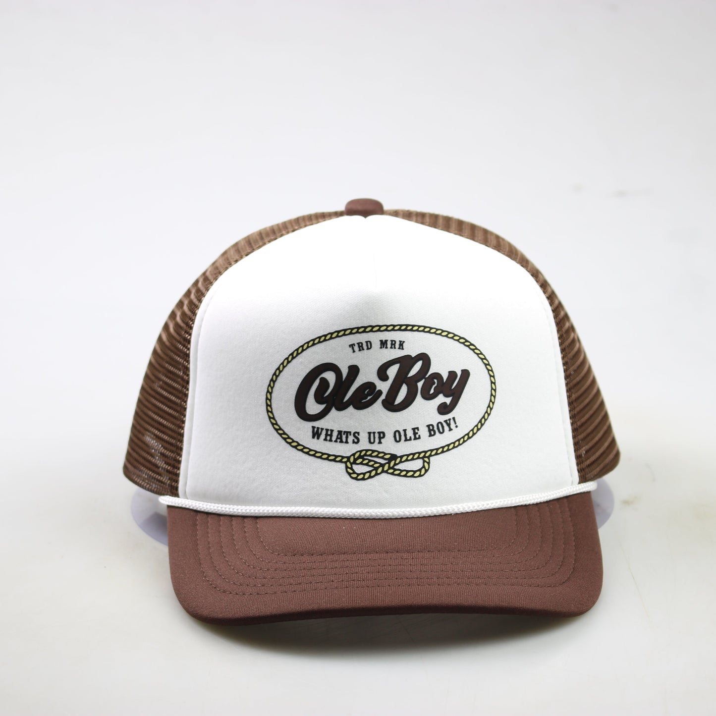 Trucker hat with brown brim and white front panel featuring 'Ole Boy' logo on a white background