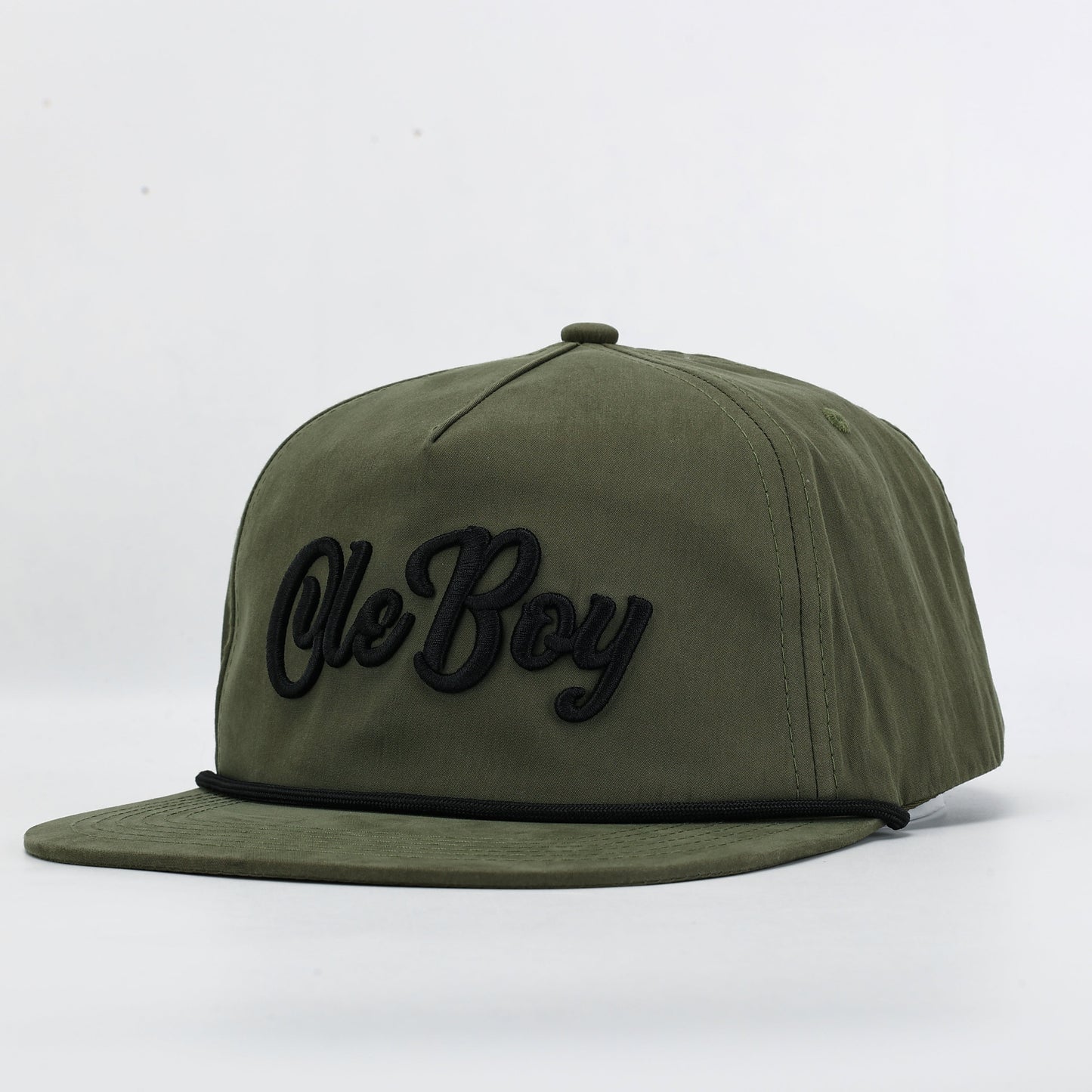 Green cap with 'Ole Boy' text on a white background