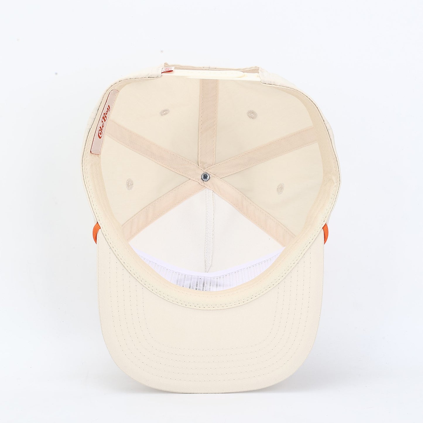 Beige baseball cap with orange accents on a white background