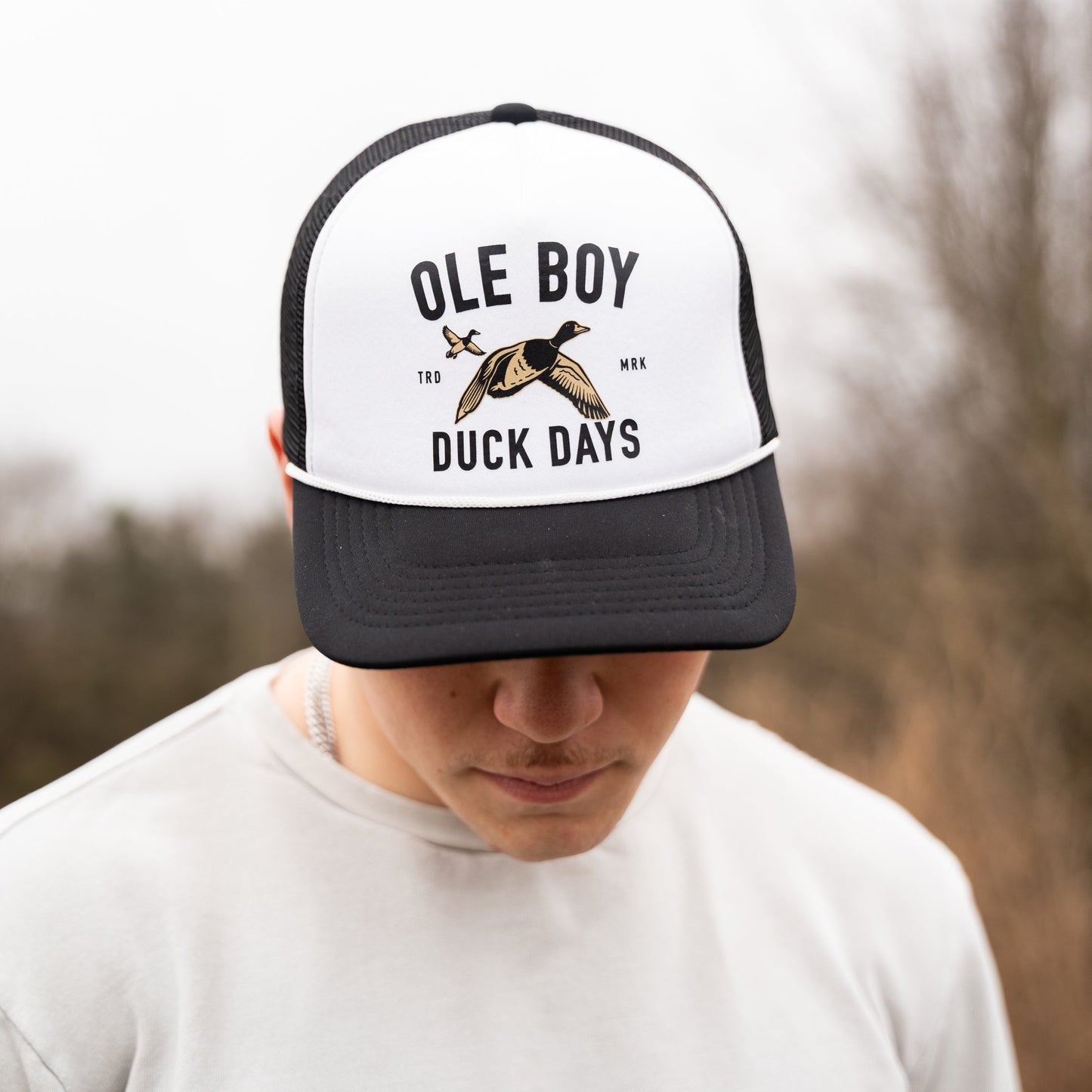 Person wearing a cap with 'Ole Boy' and 'Duck Days' text and logo.