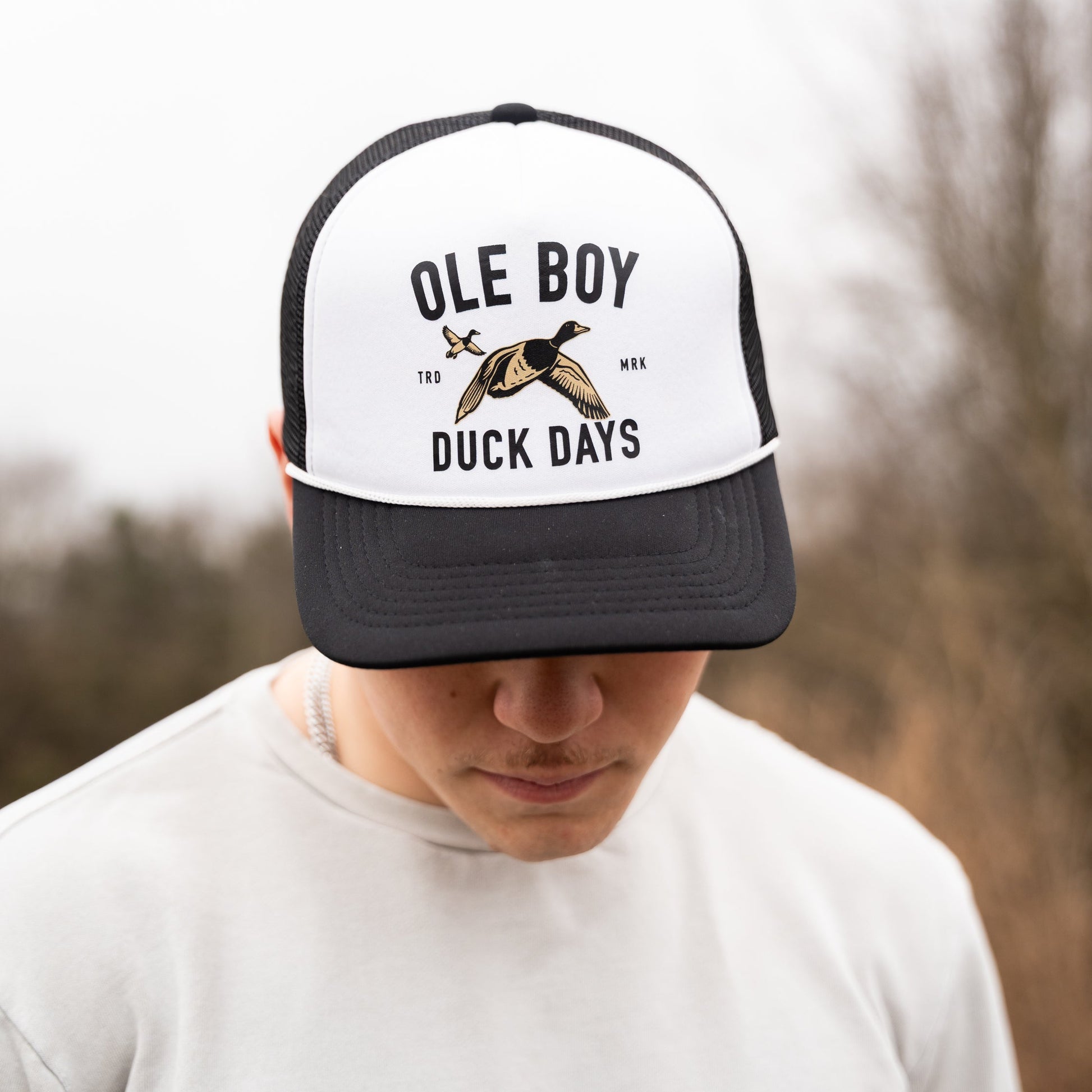 Person wearing a cap with 'Ole Boy' and 'Duck Days' text and logo.