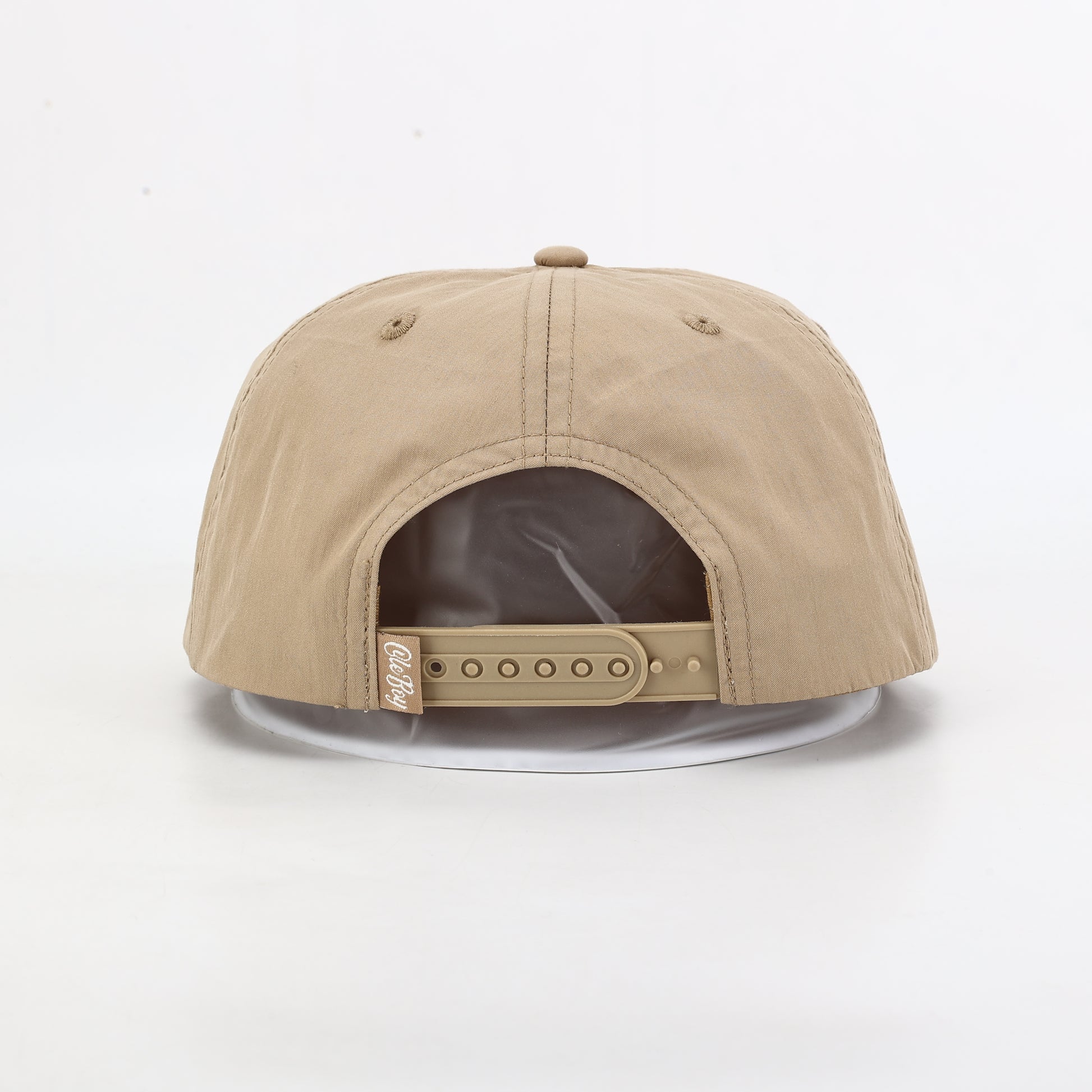 Beige cap with a clear visor on a white background