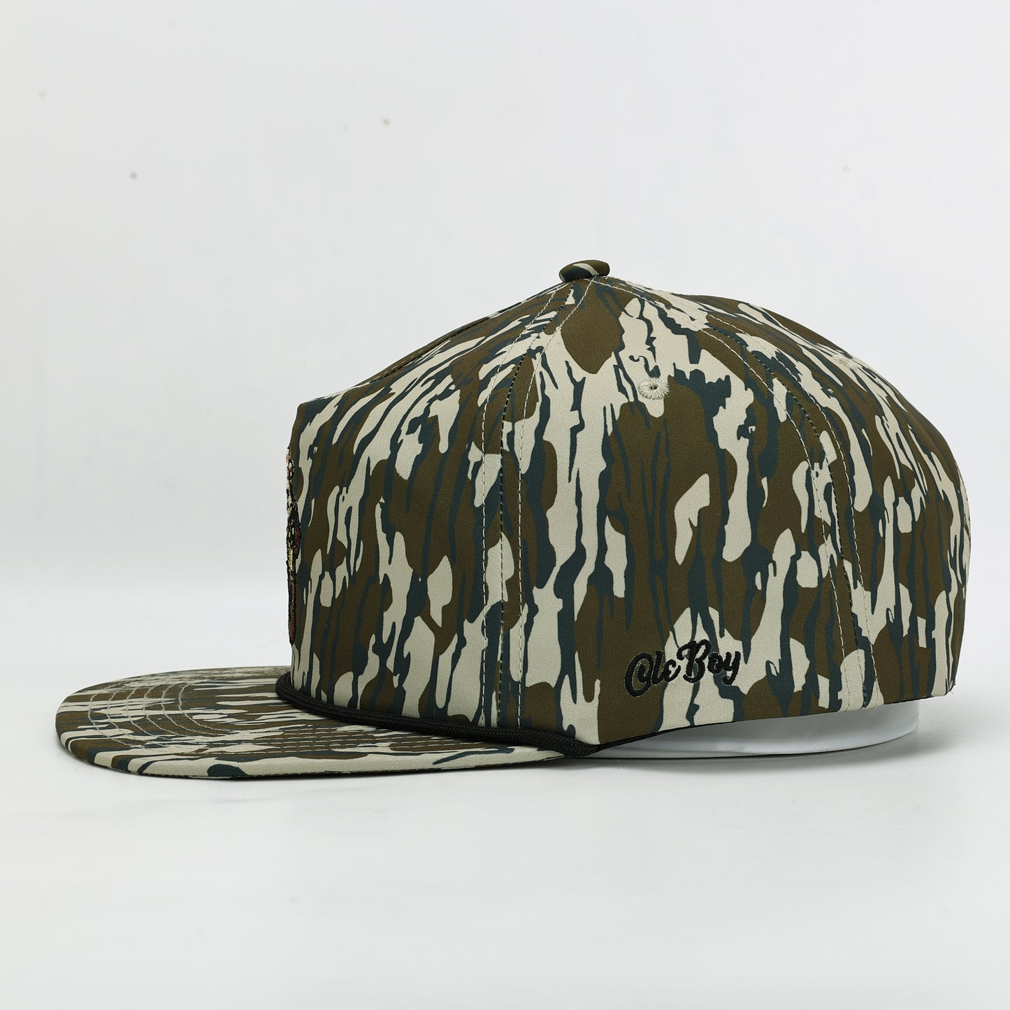 Camouflage-patterned cap with a brand logo on a white background