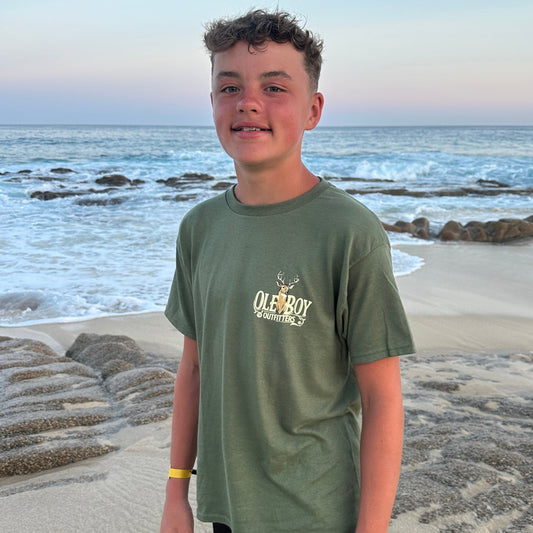 Person standing on a beach with ocean view