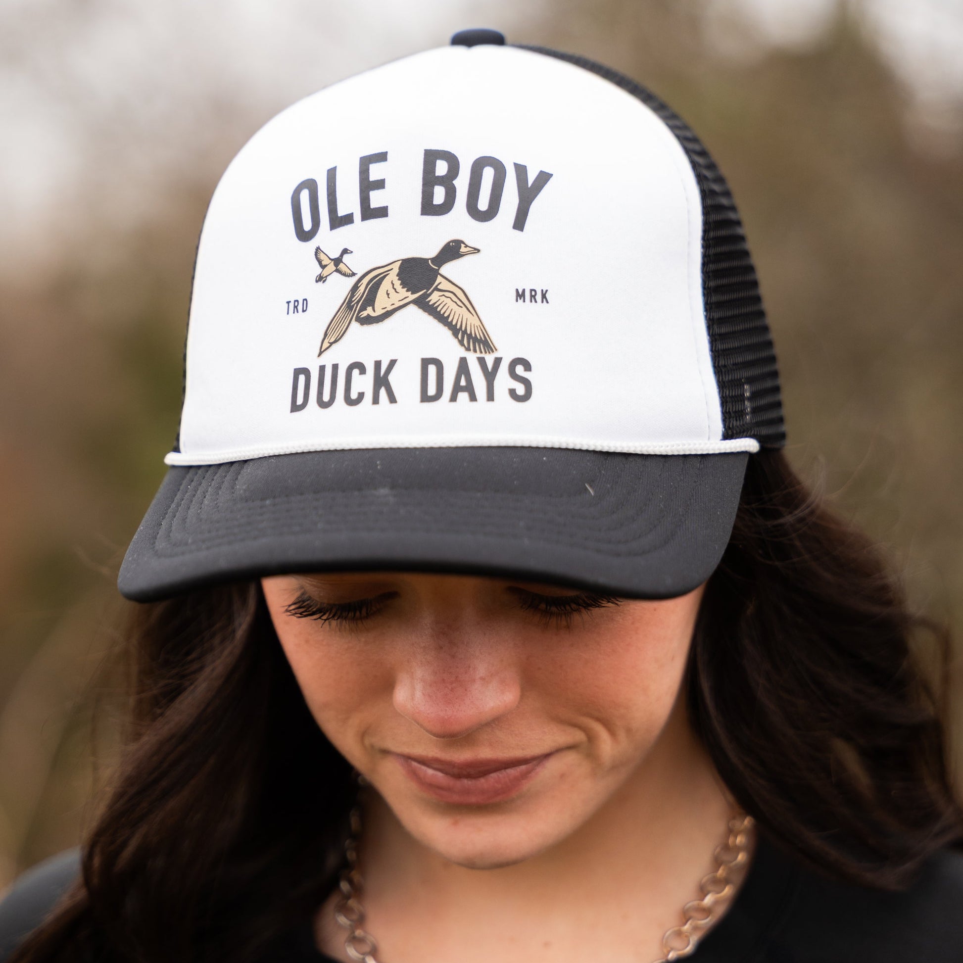 Person wearing a cap with 'Ole Boy' and 'Duck Days' text and logo.