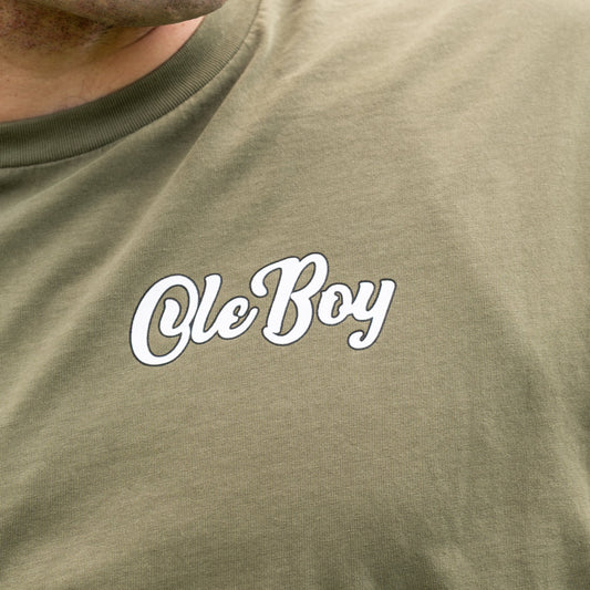 Green t-shirt with 'Ole Boy' text in white on a plain background